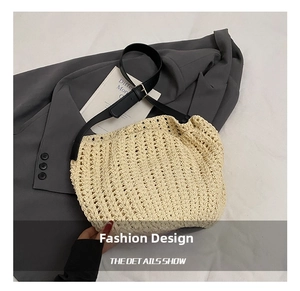 Detail of beige woven beach bag showing hollow texture and adjustable black leather strap