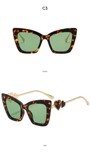 Front and side view of cat eye sunglasses with tortoiseshell frames and gold temples