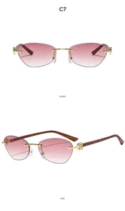 Front and side view of rimless cat-eye sunglasses with pink gradient lenses and C7 logo
