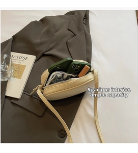 Interior view showing the capacity of this cream pillow bag with high-quality PU texture