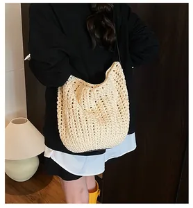 Detail of hand-woven cream hollow texture on this large casual shoulder beach bag