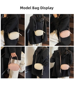 Mini oval crossbody bag with pebbled texture and metal pendant shown on model