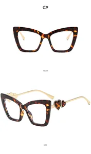 Detailed front and side views of tortoise shell cat-eye frames with golden heart temples