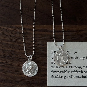 Minimalist S925 sterling silver coin necklaces with Queen Elizabeth II profile on wood