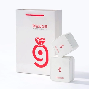 Detailed view of white jewelry gift box set with matching red handle shopping bag
