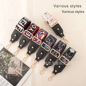 Detail of various adjustable patterned shoulder straps with gold lobster clasps