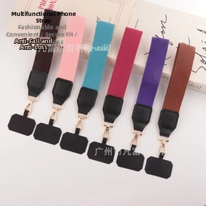 Close-up of colorful adjustable woven phone straps with golden clips in six assorted colors