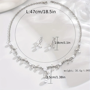 Detail of silver pearl bridal jewelry set with dimensions and vine-shaped leaf design