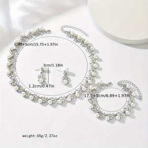 Bridal jewelry set showing necklace, earrings and bracelet with vine pearls and crystals