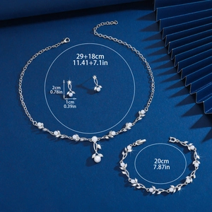 Silver bridal jewelry set featuring leaf motifs, pearls, and size dimensions in cm and inch