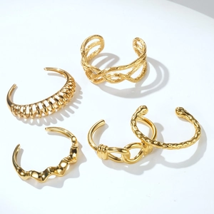 Set of 4 gold-plated stainless steel open cuff bracelets with diverse textured patterns