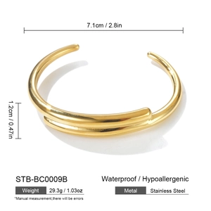 Detail view of gold open cuff bracelet showing dimensions of 7.1cm diameter and 1.2cm width