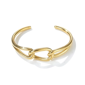 Detailed close-up of gold stainless steel open cuff bracelet with hollow chain link design