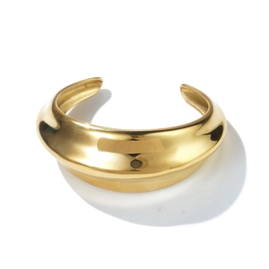 Top view of thick minimalist gold plated stainless steel open bangle with polished finish