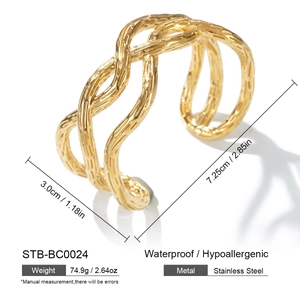 Detailed view of gold stainless steel open cuff bracelet with woven texture and dimensions