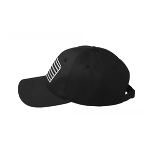 Detail of adjustable metal buckle and breathable eyelets on vintage black baseball cap
