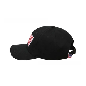 Detail showing distressed American flag patch embroidery on black cotton baseball cap