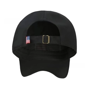 Detail of black washed baseball cap featuring bronze buckle and US flag patch