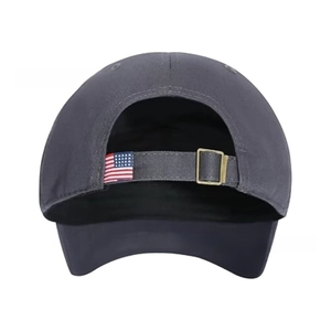 Detail of gray baseball cap back with metal buckle and small American flag patch