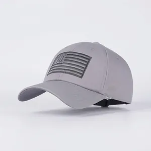 Detail of vintage grey baseball cap featuring monochrome US flag embroidery on cotton