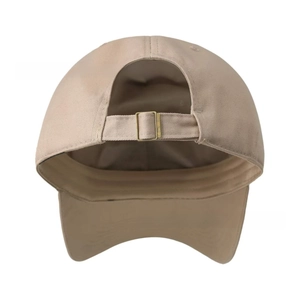 Detail of khaki cotton baseball cap showing adjustable fabric strap and vintage metal buckle