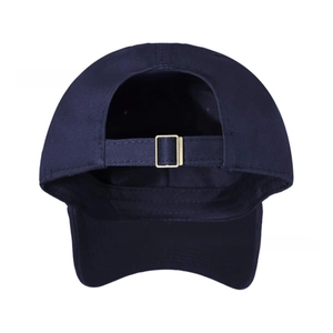 Detail view of the navy blue baseball cap back with adjustable gold metal buckle