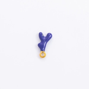 Detail of purple enamel heart pendant with golden metal loop for DIY jewelry making