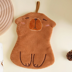 Detailed view of plush Kapibara hand towel featuring soft coral fleece and hanging loop