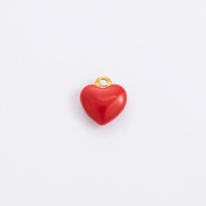 Detail of red enamel heart pendant with golden ring clasp for DIY jewelry making