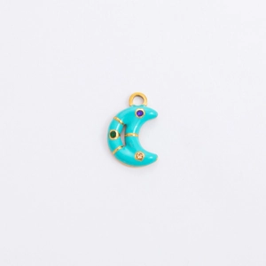 Detail of crescent moon pendant with turquoise enamel and colorful zircons in gold finish