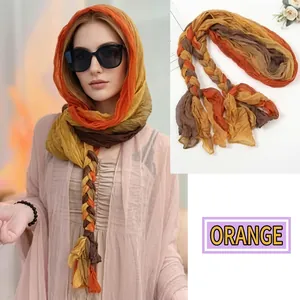 Detail of orange yellow gradient sun protection shawl with lightweight chiffon texture