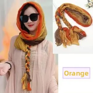 Detail of orange yellow gradient sun protection shawl with lightweight chiffon texture