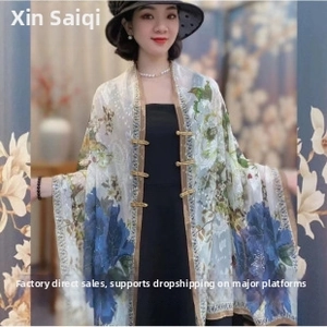 Detail view of floral chiffon sun shawl with traditional Chinese button closure