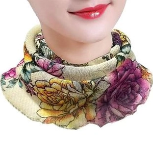 Detail of floral chiffon sun protection scarf with purple and yellow flower patterns