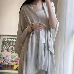 Detail of light beige chiffon sunscreen shawl with soft drape and refined edge stitching