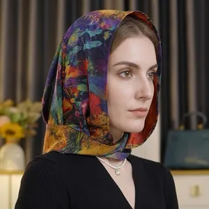 Detail of artistic chiffon scarf with abstract oil painting print worn as a headband