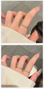 Detail of thin 18k gold plated ring featuring micro-set cubic zirconia in a stacked style