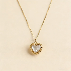 Vintage gold plated heart necklace with iridescent mother of pearl shell and baroque detail