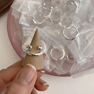 Detailed view of an S925 sterling silver smiling face ring with a polished finish