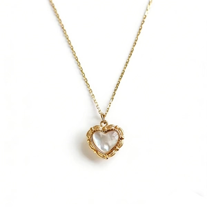 Vintage gold heart necklace with white mother-of-pearl and embossed floral pattern