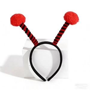 Christmas insect headband with red fuzzy balls and black striped antenna for party dress up