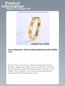 Detailed view of titanium steel bangle with clover patterns and 10mm width measurement