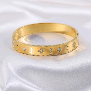 Luxury gold titanium clover bangle with sparkling zircon pavé and beaded edges