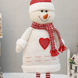 Charming red and white knitted snowman doll with heart detail and long striped legs