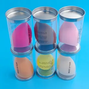 Set of six colorful makeup sponges in individual clear tubes on a bright blue background