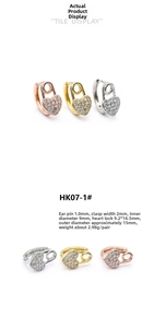 Detail view of 18K gold plated heart lock safety pin earrings with zircon stones