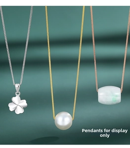 S925 silver chain details showing clover charm, pearl, and emerald jade bead pendants