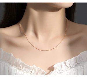 Minimalist S925 sterling silver rose gold box chain necklace worn on model's neckline