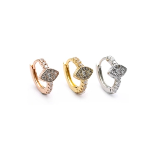 Three hoop earrings in rose gold, gold and silver featuring zircon evil eye charms