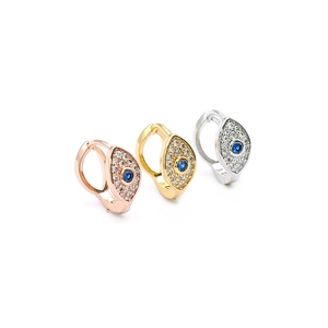 Detailed macro view of evil eye hoop earrings in gold, silver, and rose gold finishes